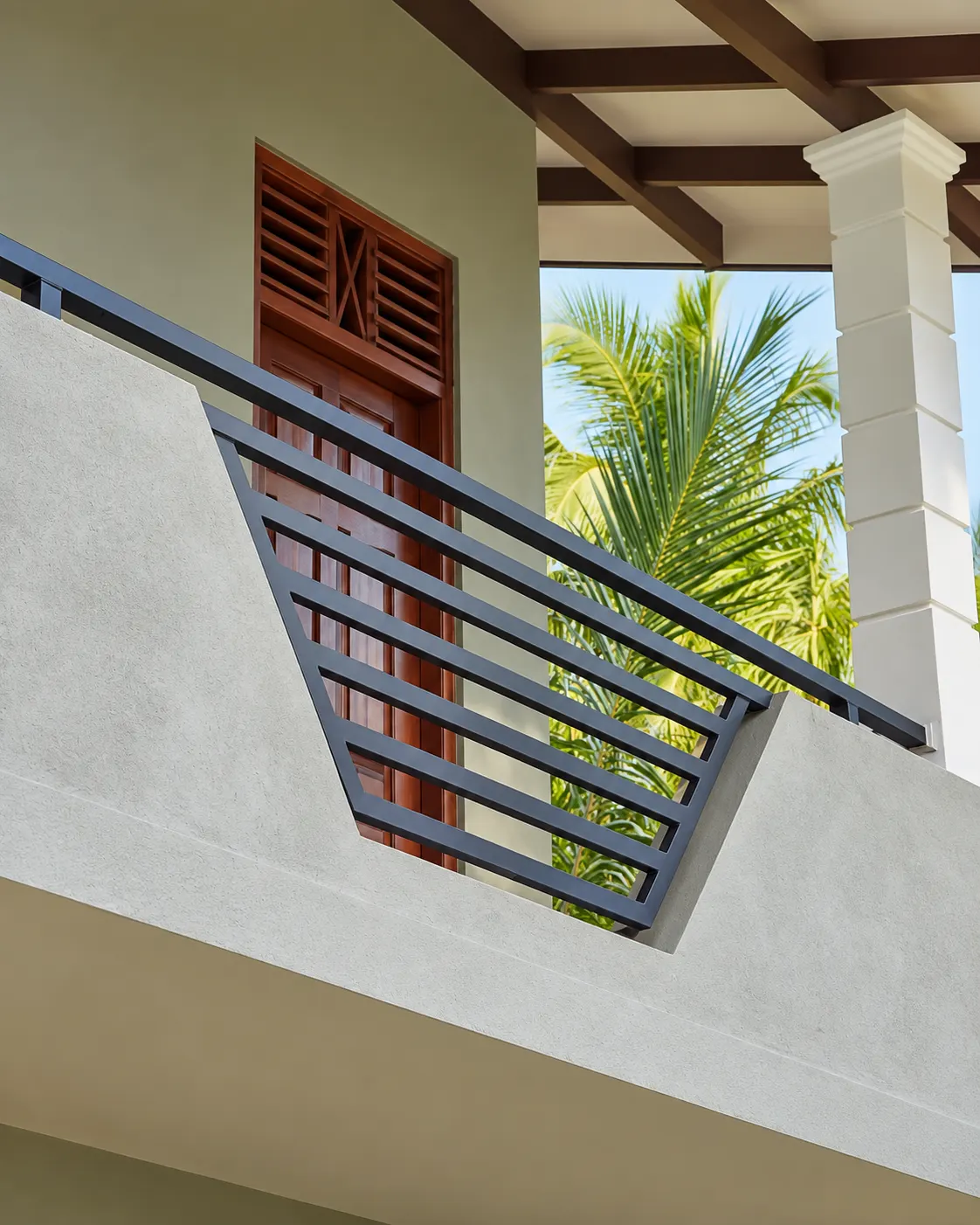 Angled black steel balcony privacy screen