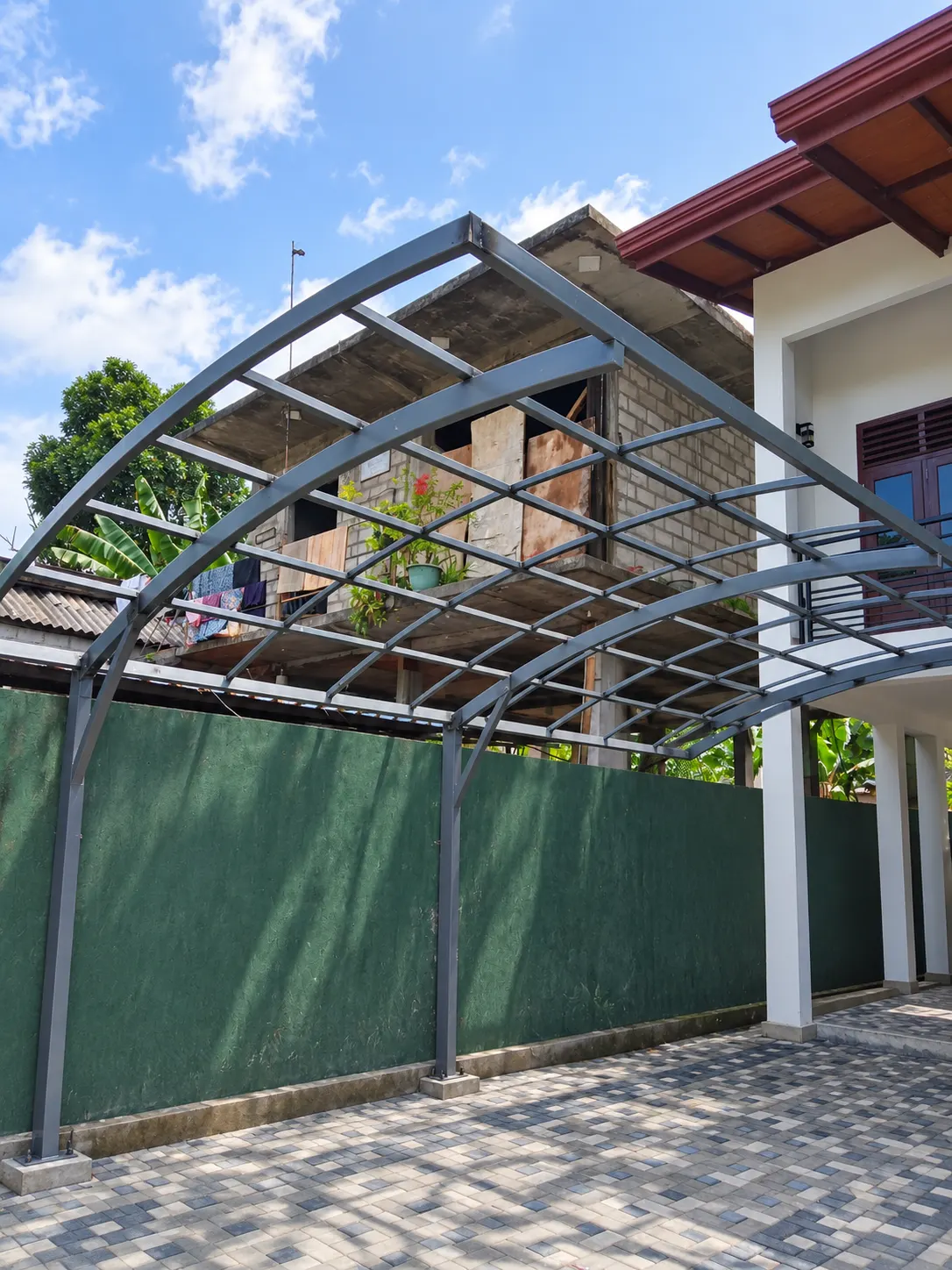 Curved carport frame under construction
