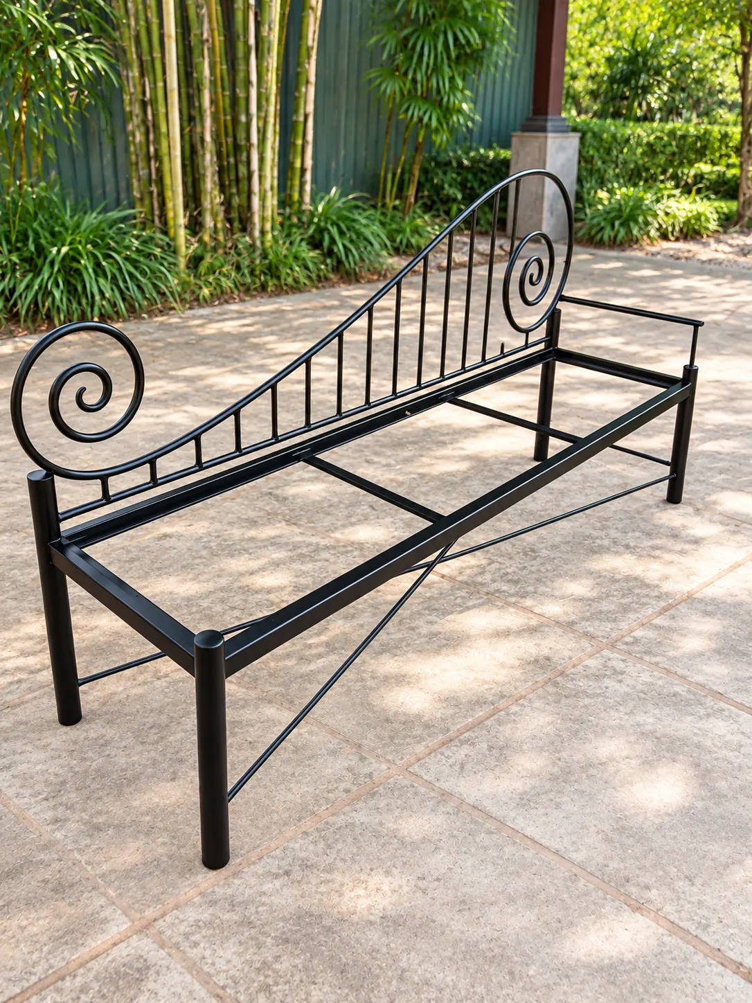 Black steel garden bench with scrolled armrests